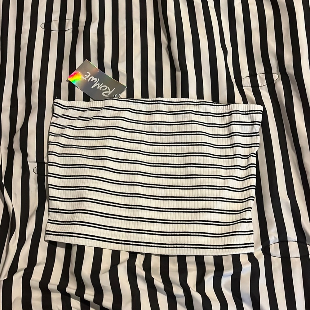This is a white with black stripes cropped tube top.